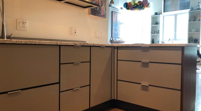 Aluminum kitchen cabinets in two-tone brown and beige and including smart corner pull-out