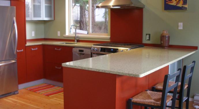 brick red, glass uppers, recycled glass countertop olive colour, red backsplash