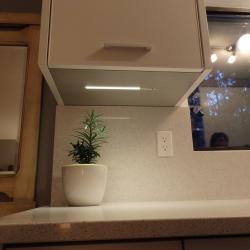 bone white aluminium galley kitchen under cabinet LED lighting