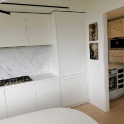 Aluminum pantry cabinets in grey and including doors in Neolith