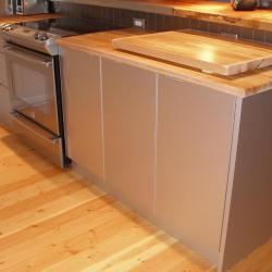 Contemporary silver aluminum cabinets with butcher block countertops