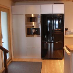 Contemporary silver aluminum cabinets with butcher block countertops