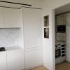 Aluminum pantry cabinets in grey and including doors in Neolith