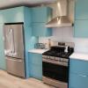 Aluminum kitchen cabinets including pantry in Robin's Egg Blue