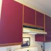 before photo of burgundy 80s style kitchen